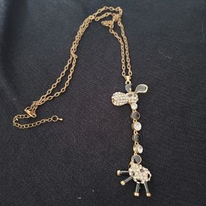Black and white and crystal long neck giraffe locket necklace